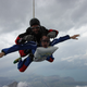 Illustration for article titled Pure Nerd Insanity: Two Men Skydiving with a Girly Hug Pillow
